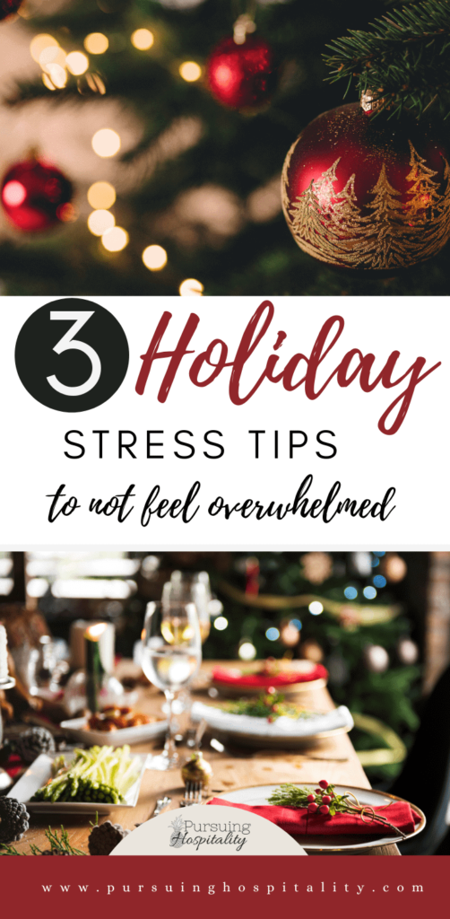 Bright red Christmas ornament on a tree with a beautiful table set for Christmas dinner . Title 3 Holiday stress tips to not feel overwhelmed